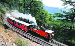 British-built 1905 engine runs on Kalka-Shimla Unesco World Heritage railway track in Shimla recently.  