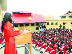 Swami Vighananand addresess students at a function in Nurpur.