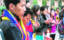 Tibetans hold a candle-light march at McLeodganj on Tuesday evening. Photo: Kamaljeet