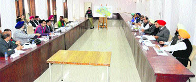 A meeting of the MC regarding property tax under way at the Zone A office in Ludhiana on Tuesday. 
