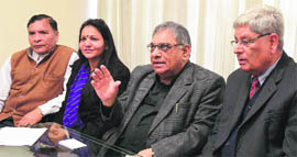 Dr Kewal Dheer (centre), chairman of Adeeb International, addresses a press conference in Ludhiana.