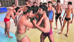 Budding wrestlers practise on judo mats at the Guru Nanak Stadium in Ludhiana.