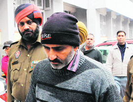 Pawan Kumar in police custody in Amritsar.