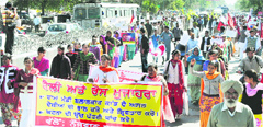 Members of various organisation holding a protest march against the police, in Bathinda on Wednesday. Tribune photo: Pawan Sharma