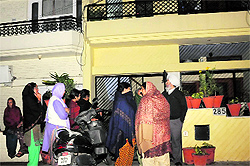 Residents gathered outside the house of the victim, Amanpreet Singh, at Phase III A in Mohali on Wednesday evening