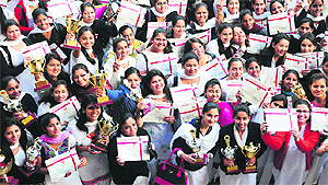 Students in a jubilant mood after receiving certificates and mementoes during the prize distribution function at the Post Graduate Government College for Girls in Sector 42, Chandigarh, on Wednesday