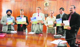 Dr VK Bahuguna, Director General, Indian Council of Forestry Research and Education, releases the annual report of the World Bank-funded project on sustainable land and ecosystem management in Dehradun on Wednesday