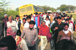 A school bus overturned near Babupur village on the Gurgaon-Delhi border in Gurgaon on Wednesday. The Gurgaon police arrested the drunken driver after the accident. The bus was carrying around 80 students, but none of them received any major injury. 
