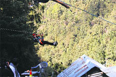 Gujarati students perform river crossing in a valley in the Dalhousie hills.