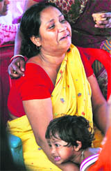 A wailing relative of one of the victims. 
