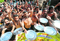 Activists of the All J&K Casual Labourers Union Power Development Department protest outside the office of the Chief Engineer (ME) wing in Jammu on Wednesday