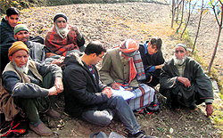Historian Iliyas Rizvi interacts with residents of Dhara, on the ourskirts of Srinagar