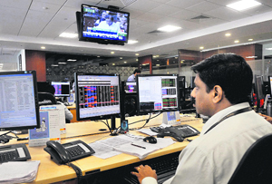 A broker reacts while watching the impact of the FY2014 budget on the markets at the Bombay Stock Exchange on Thursday. The benchmark BSE S&P Sensex tumbled by 291 points to a fresh three-month low post-budget.