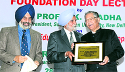 Chancellor of the Central University of Punjab SS Johl (middle) and vice-chancellor Jai Rup Singh felicitate Prof SK Chadha of the South Asian University, New Delhi, on the concluding day of the universitys Foundation Day celebrations in Bathinda on Thursday