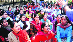 Contractual employees protest outside the Vice-Chancellor office at Panjab University on Thursday.