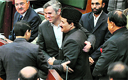 Chief Minister Omar Abdullah greets newly elected Assembly Speaker Mubarak Gul on the first day of the budget session in Jammu on Thursday