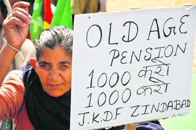 Activists of the Jammu Kashmir Democratic front (JKDF) hold a protest demanding increase in old age pension in Jammu on Thursday.