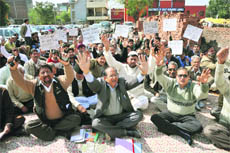 Members of the All India Backward Classes Union hold a protest outside the Divisional Commissioner Office in Jammu on Thursday.