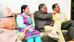 Industralist Jagatvir Singh, along with his friend Rajiv Jain, wife Davinder Kaur and his mother, watch the Budget highlights at their home in Ludhiana