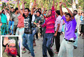 Jamaat-e-Islami activists march with sticks during a clash with the police in Thakurgaon, near Dhaka, on Thursday; (inset) Delwar Hossain Sayedee.