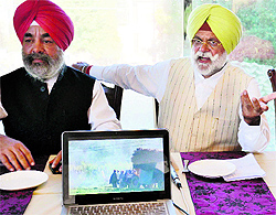 Congress MLA Rana Gurjit Singh (right) addresses mediapersons in Amritsar on Friday