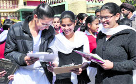 Students discuss answers after the examination.