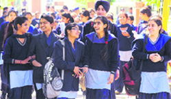 Students come out of the examination hall at DAV School, Sector 15, Chandigarh, on Friday. tribune photo: S Chandan