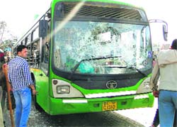 A damaged bus after Fridays protests in Delhis Mongolpuri area