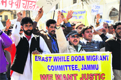 Activists of the Erstwhile Doda Migrants Committee protest at the Mubark Mandi Complex in Jammu on Friday. Tribune photo: Inderjeet Singh