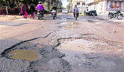 Ladowali Road (above) and Grain Market Road which have been damaged after the recent rain in Jalandhar