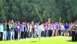 A student throws a javelin during the annual athletics meet at SCD College in Ludhiana on Friday. 