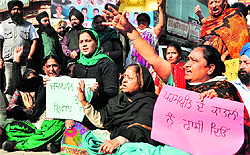 Relatives of Parampreet Kaur, daughter-in-law of Patiala ex-Mayor Jaspal Pardhan, hold a protest in Patiala