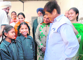 Kiran Bedi interacts with students during her visit to Citizens Forum Vidya Mandir School at Maqboolpura in Amritsar on Saturday.