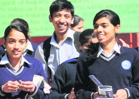 Students in a jubilant mood outside GMSS School, Sector 21, in Chandigarh on Saturday