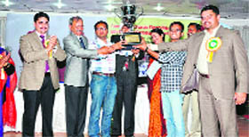 The winners receive the trophy at the Gurcharan Singh Memorial 6th National Debate Competition held at Sardar Bhagwan Singh Institute of Bio-Medical Sciences, near Dehradun, on Saturday.