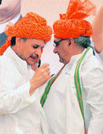 A file photograph of Haryana Chief Minister Bhupinder Singh Hooda and Congress MP from Gurgaon Rao Inderjit Singh at a public function.