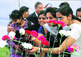 Visitors during a flower show at a park in Gurgaon on Saturday. 