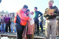 Wailing relatives of  the deceased Rajesh Kakkar, who allegedly committed suicide by jumping before a moving train in Jalandhar on Saturday. 