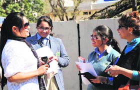 Students of Class X discuss question papers after coming out of their exmination centres in Jammu on Saturday