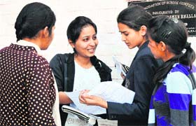 Students of Class XII discuss question papers after coming out of their exmination centres in Jammu on Saturday