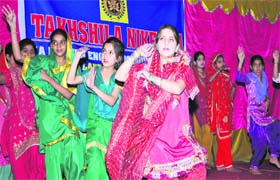 Colour and festivity: Students present a cultural item during a prize distribution function at Takshila Niketan School in Jammu on Saturday