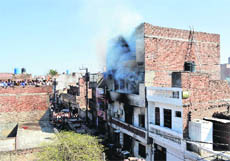 Smoke emanates from a hosiery unit on Kakowal Road in Ludhiana on Saturday. 