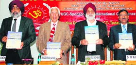 (Right to left ) DAV College principal KN Kaul, University of Jammu Vice-Chancellor Sudarshan Kappor and Dr Hardeep Singh release a book during the international conference at DAV College in Amritsar on Sunday