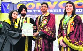 DCP Dr Kaustubh Sharma gives a degree to a student at the convocation function of Sri Guru Teg Bahadur College for Women in Amritsar on Sunday