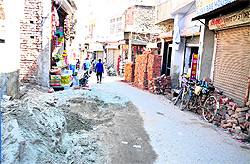 Construction material dumped on a road leading to the Fort in Bathinda
