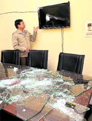 A person shows a damaged LCD screen at a house in Phase XI, Mohali, on Sunday.