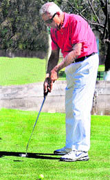 Justice Nawab Singh in action during a golf tournament at the Chandigarh Golf Club on Saturday.