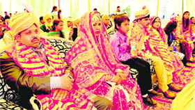 Brides and bridegrooms at a mass marriage function held at the Ramlila Ground in Sector 27, Chandigarh, on Sunday. 