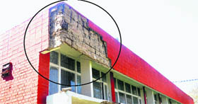 A damaged portion of the Civil Dispensary in Dhanas.