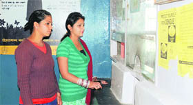 Patients wait for the pharmacist at the dispensary.